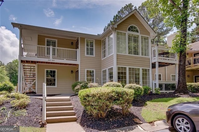 view of front of property featuring stairs