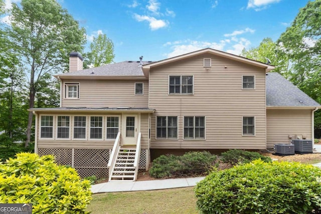 4002 Turnstone Dr NW, Kennesaw, GA 30152 - rear view of property with a chimney, stairway, central AC, and a shingled roof