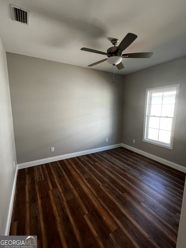 1005 Syrup Mill Creek Ln, Cairo, GA 39828 - unfurnished room with baseboards, dark wood finished floors, and ceiling fan