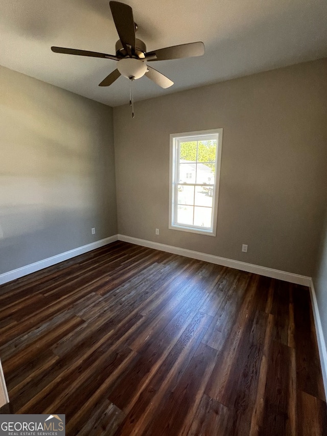 1005 Syrup Mill Creek Ln, Cairo, GA 39828 - unfurnished room with baseboards, dark wood-type flooring, and ceiling fan
