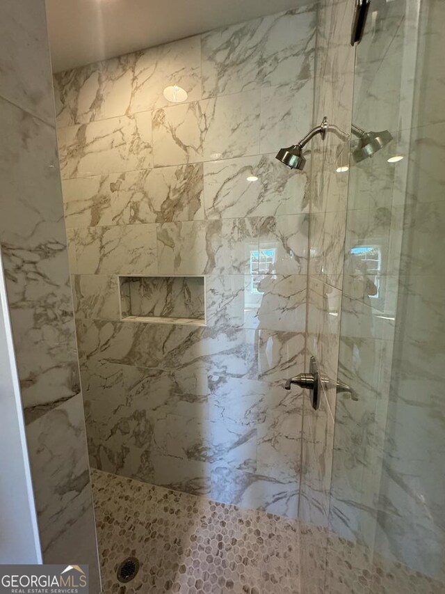 1005 Syrup Mill Creek Ln, Cairo, GA 39828 - full bathroom featuring a marble finish shower