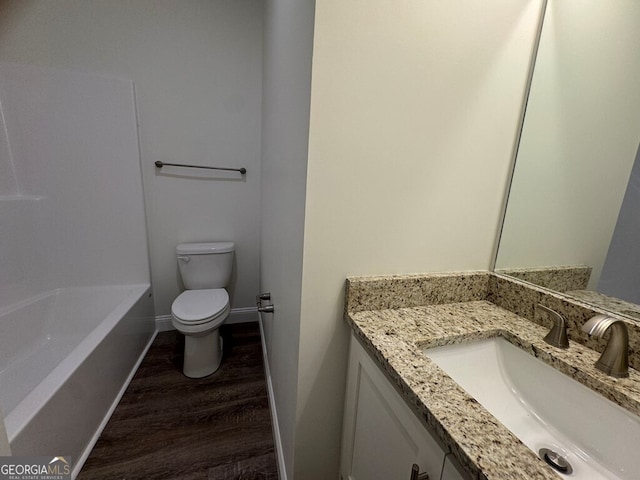 1007 Syrup Mill Creek Ln, Cairo, GA 39828 - full bathroom with wood finished floors, toilet, vanity, and baseboards
