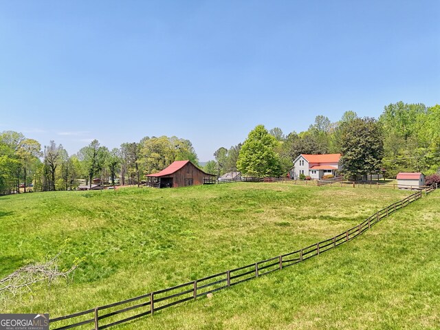 1096 Sutton Mill Rd, Clarkesville, GA 30523 - view of yard with a barn, an outdoor structure, and a rural view