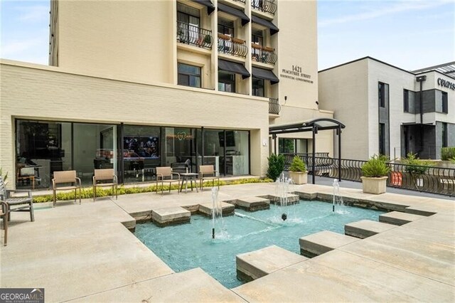 1421 Peachtree St NE Unit 203, Atlanta, GA 30309 - swimming pool with a patio