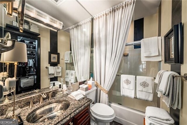 1421 Peachtree St NE Unit 203, Atlanta, GA 30309 - bathroom featuring shower / bath combo with shower curtain and vanity