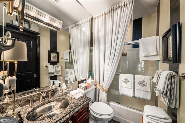 1421 Peachtree St NE Unit 203, Atlanta, GA 30309 - bathroom featuring shower / bath combo with shower curtain and vanity