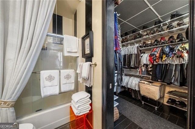 1421 Peachtree St NE Unit 203, Atlanta, GA 30309 - full bathroom featuring bath / shower combo with glass door and a walk in closet