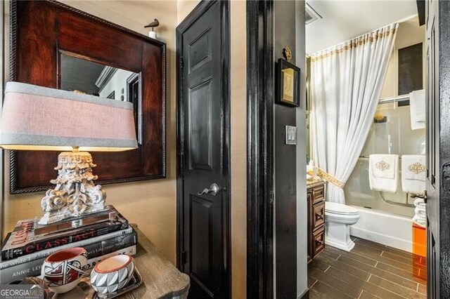 1421 Peachtree St NE Unit 203, Atlanta, GA 30309 - full bath with shower / bath combo with shower curtain and wood finished floors