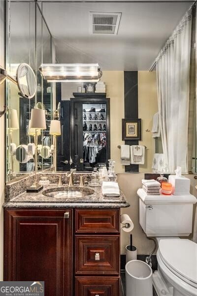 1421 Peachtree St NE Unit 203, Atlanta, GA 30309 - bathroom with toilet and vanity