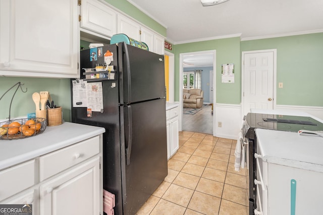 139 Heath Dr S, Macon, GA 31220 - kitchen with stainless steel range with electric cooktop, freestanding refrigerator, white cabinetry, light countertops, and crown molding