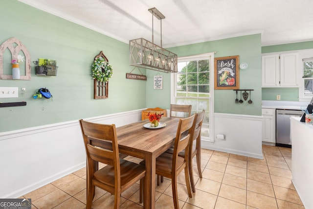 139 Heath Dr S, Macon, GA 31220 - dining space featuring light tile patterned flooring, crown molding, a wainscoted wall, a textured ceiling, and a chandelier