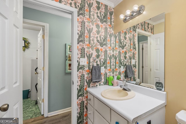 139 Heath Dr S, Macon, GA 31220 - bathroom featuring ornamental molding, wallpapered walls, wood finished floors, vanity, and toilet