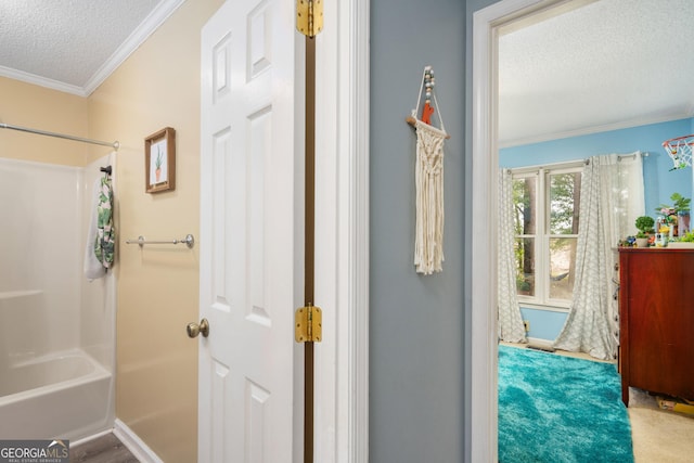 139 Heath Dr S, Macon, GA 31220 - full bath with a textured ceiling, crown molding, and bathtub / shower combination