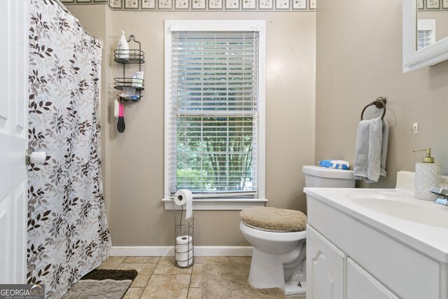 11 Vintage Ct SW, Cartersville, GA 30120 - bathroom with toilet, baseboards, tile patterned flooring, vanity, and a shower with shower curtain