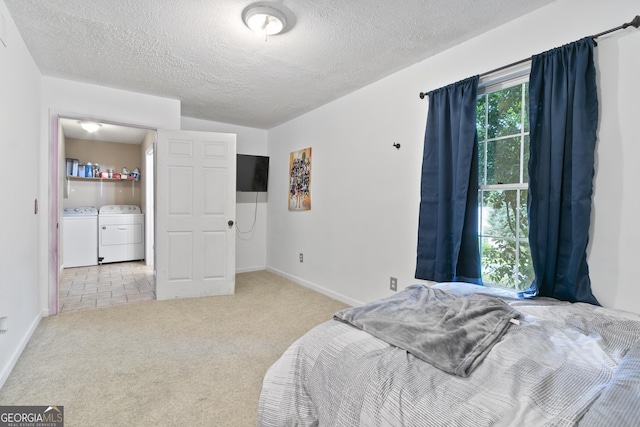 11 Vintage Ct SW, Cartersville, GA 30120 - bedroom featuring washing machine and clothes dryer, carpet floors, a textured ceiling, and baseboards