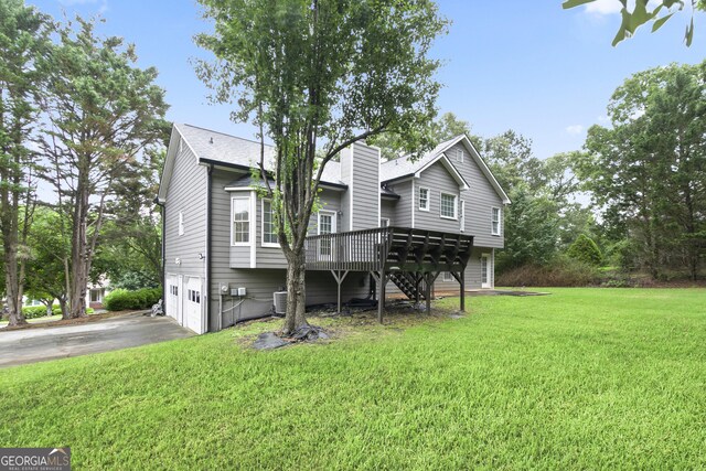 11 Vintage Ct SW, Cartersville, GA 30120 - rear view of property featuring a garage, stairway, driveway, a wooden deck, and a yard