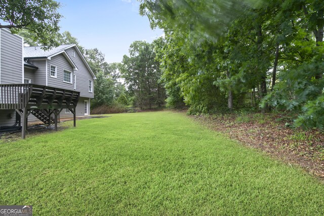 11 Vintage Ct SW, Cartersville, GA 30120 - view of green lawn featuring a deck and stairs