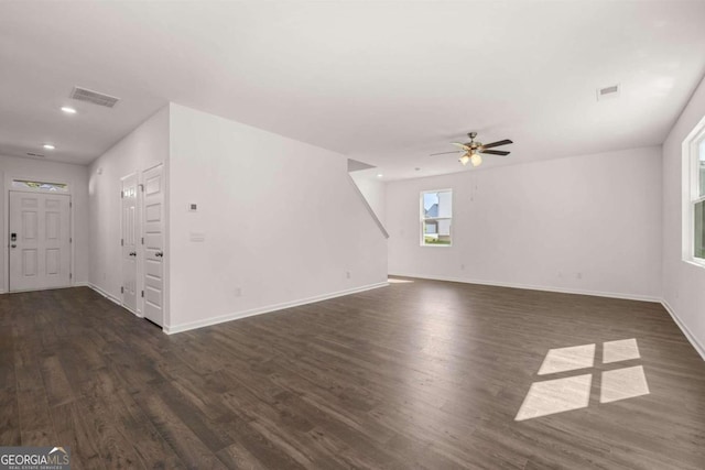 unfurnished living room featuring dark wood-type flooring, baseboards, ceiling fan, and recessed lighting
