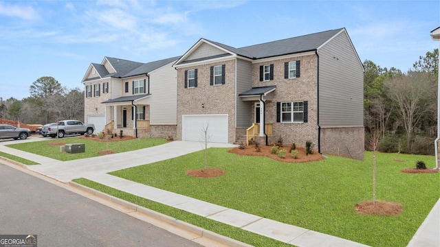 1483 Autumn Wind Dr, Dacula, GA 30019 - craftsman house featuring a garage, concrete driveway, a front yard, and brick siding