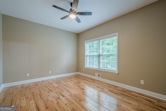 516 Main St, Hiram, GA 30141 - unfurnished room with light wood-style floors, a ceiling fan, and baseboards