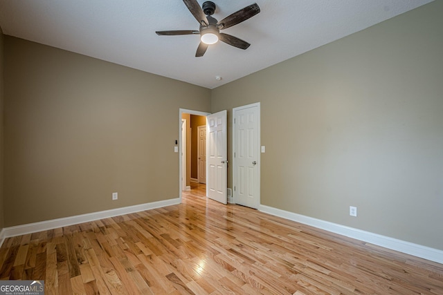 516 Main St, Hiram, GA 30141 - spare room featuring light wood-type flooring, a ceiling fan, and baseboards