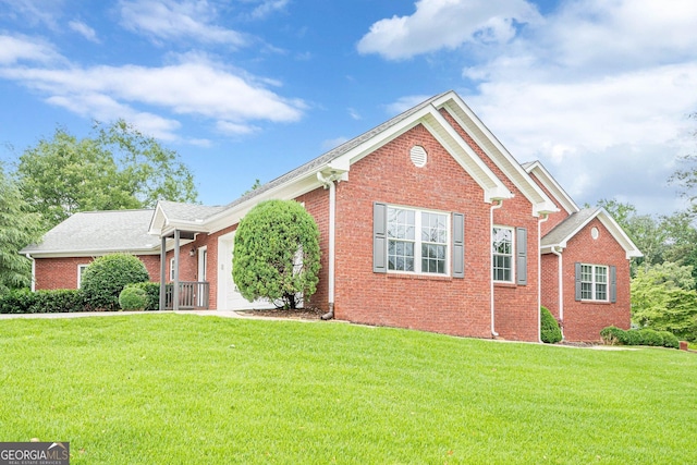 516 Main St, Hiram, GA 30141 - view of front facade featuring brick siding and a front yard
