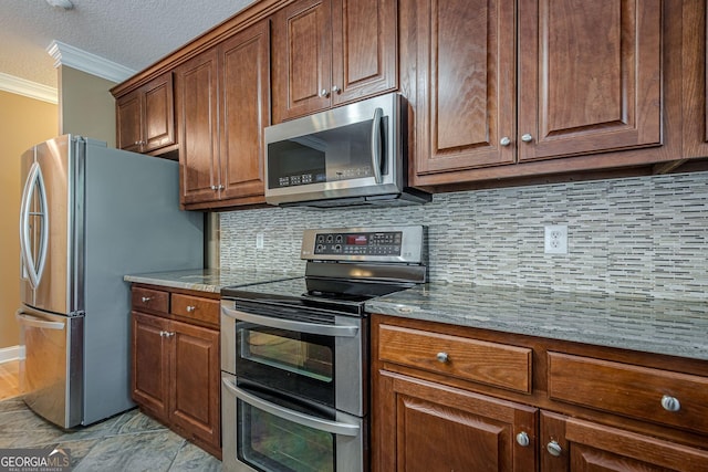 516 Main St, Hiram, GA 30141 - kitchen featuring stainless steel appliances, crown molding, tasteful backsplash, light stone countertops, and a textured ceiling