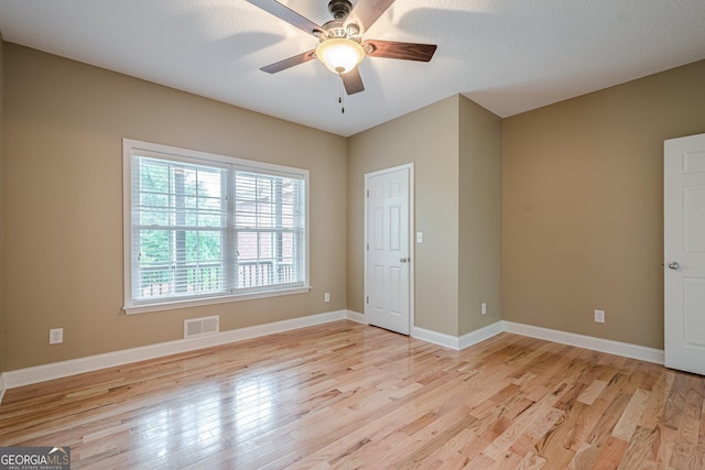 516 Main St, Hiram, GA 30141 - empty room featuring light wood-style floors, ceiling fan, and baseboards