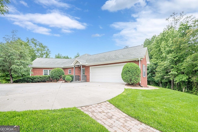 516 Main St, Hiram, GA 30141 - ranch-style home with brick siding, driveway, an attached garage, and a front lawn