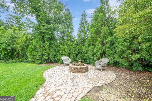 516 Main St, Hiram, GA 30141 - view of patio featuring an outdoor fire pit