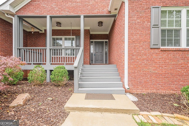 516 Main St, Hiram, GA 30141 - doorway to property with brick siding and a porch
