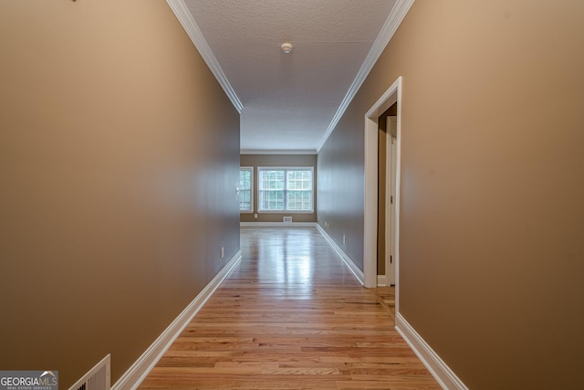 516 Main St, Hiram, GA 30141 - corridor with crown molding, light wood-style floors, baseboards, and a textured ceiling