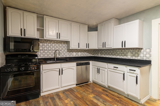 1718 16th Ave, Phenix City, AL 36867 - kitchen featuring black appliances, a sink, dark countertops, and white cabinetry