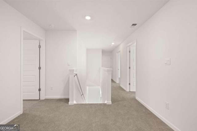 unfurnished room with carpet flooring, recessed lighting, and baseboards