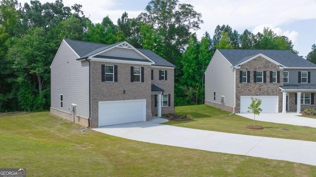view of front of house featuring an attached garage, concrete driveway, a front yard, and view of scattered trees
