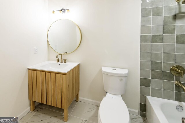 2192 Stenger Rd, Douglasville, GA 30135 - full bath with baseboards, marble finish floors, toilet, and vanity