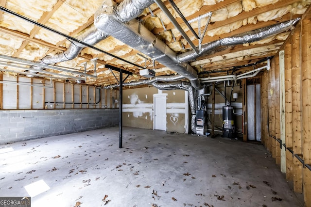 2192 Stenger Rd, Douglasville, GA 30135 - below grade area featuring gas water heater, heating unit, and concrete block wall