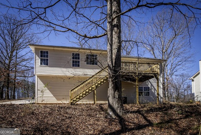 2192 Stenger Rd, Douglasville, GA 30135 - rear view of house featuring a wooden deck and stairway