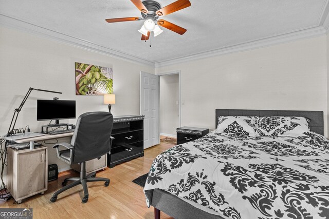 4010 Hamilton Mill Rd, Buford, GA 30519 - bedroom featuring light wood-style floors, crown molding, an office area, ceiling fan, and a textured ceiling