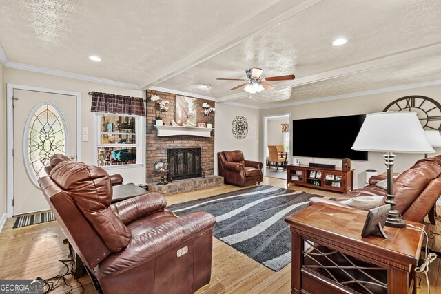 4010 Hamilton Mill Rd, Buford, GA 30519 - living room with light wood-type flooring, ceiling fan, a textured ceiling, a brick fireplace, and recessed lighting