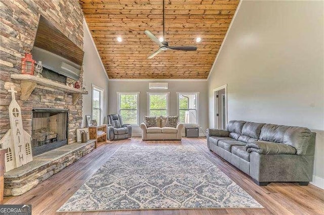 living area featuring high vaulted ceiling, ceiling fan, wooden ceiling, a fireplace, and wood finished floors