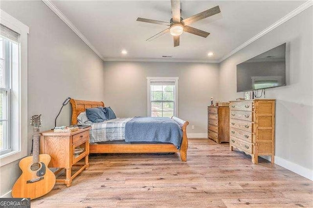 bedroom featuring ornamental molding, light wood finished floors, recessed lighting, baseboards, and ceiling fan