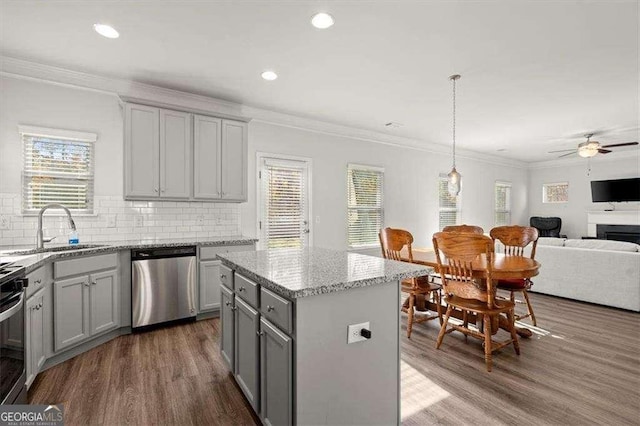 1511 Arica Ave, Lawrenceville, GA 30043 - kitchen featuring stainless steel dishwasher, gray cabinetry, a sink, a ceiling fan, and wood finished floors