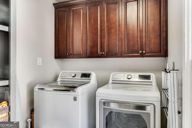 2217 Virginia Pl NE, Atlanta, GA 30305 - laundry area featuring independent washer and dryer and cabinet space