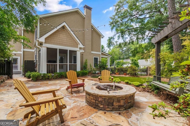2217 Virginia Pl NE, Atlanta, GA 30305 - view of patio / terrace featuring an outdoor fire pit and a sunroom