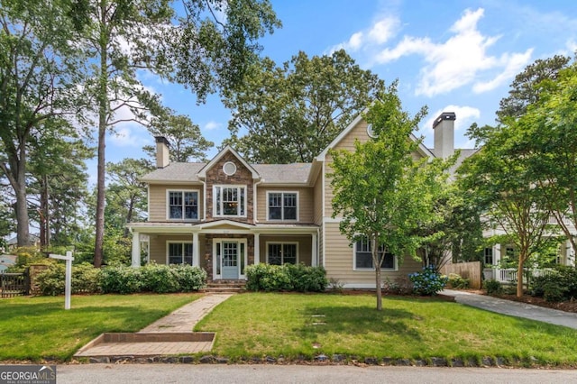 2217 Virginia Pl NE, Atlanta, GA 30305 - view of front of home featuring a chimney, stone siding, and a porch