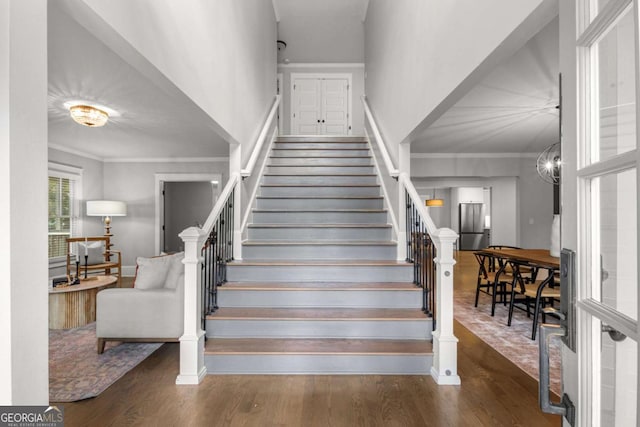 2217 Virginia Pl NE, Atlanta, GA 30305 - staircase with wood finished floors and ornamental molding