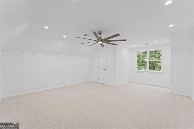 empty room with ceiling fan, recessed lighting, light colored carpet, lofted ceiling, and baseboards