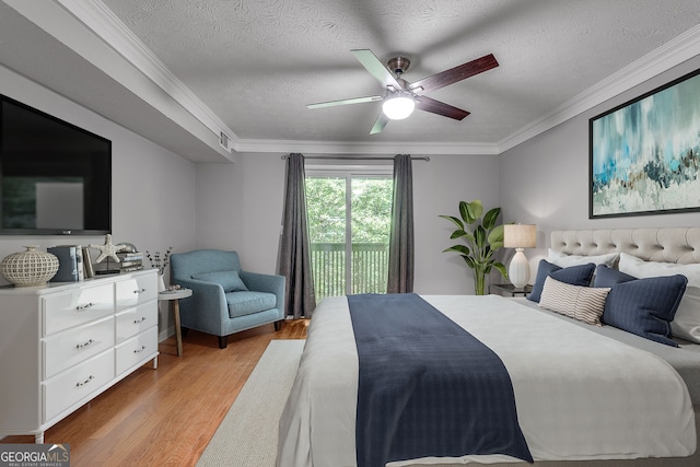 1015 Dunbar Dr, Dunwoody, GA 30338 - bedroom with light wood finished floors, access to outside, ornamental molding, a textured ceiling, and ceiling fan