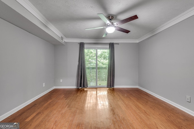 1015 Dunbar Dr, Dunwoody, GA 30338 - empty room with a ceiling fan, wood-type flooring, crown molding, and a textured ceiling